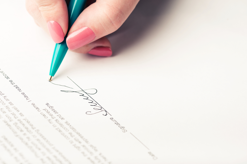 Female Hand Signing Contract